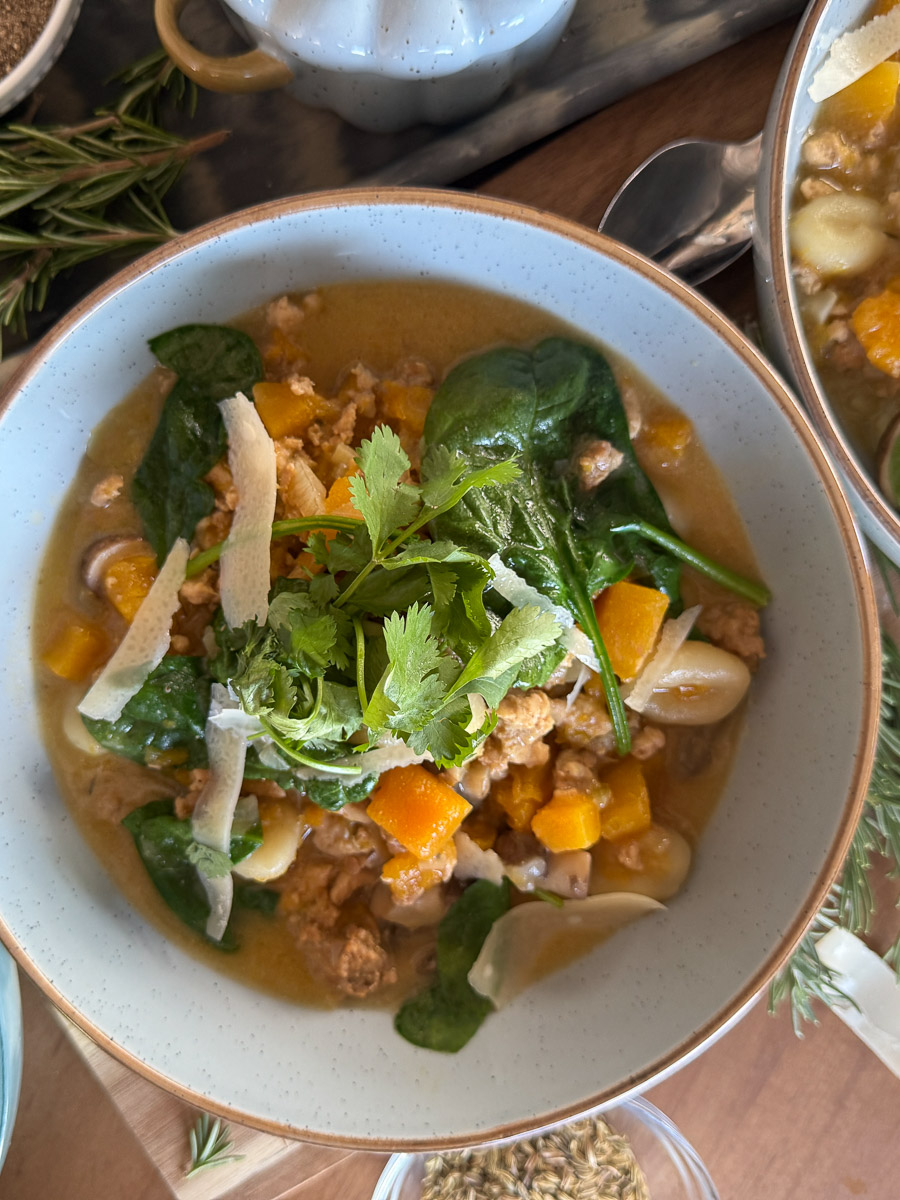 Bowl of Butternut Squash Gnocchi Soup with turkey sausage, kale, and herbs — a cozy fall recipe from Food Style Uncorked.