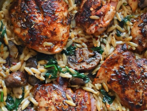 Creamy chicken mushroom orzo in a skillet with golden-seared chicken thighs, mushrooms, and spinach in a silky Marsala mascarpone sauce — an easy 30-minute fall dinner.